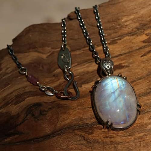 Moonstone oval pendant necklace in silver bezel and prongs