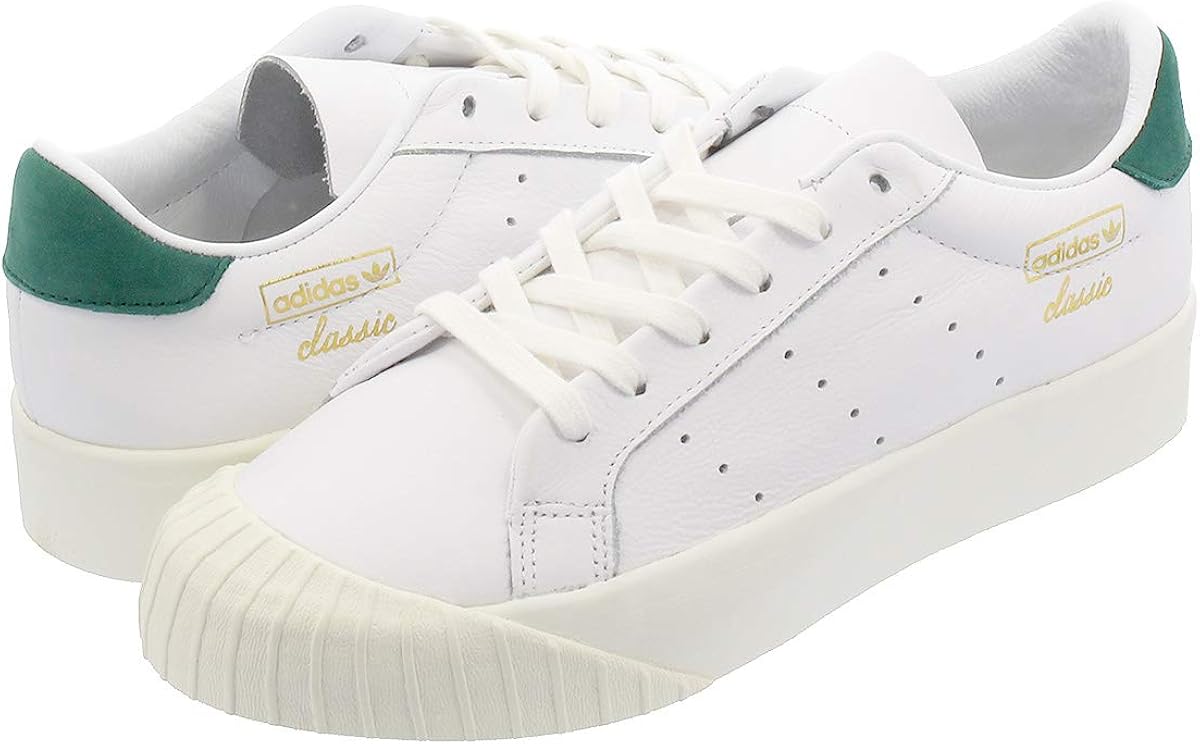 all white adidas with green