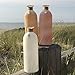WHW Whole House Worlds Beach Chic Sea Glass Vases, Set of 3, Rope Wrapped, Shell Pendant, White, Mauve and Amber, 10 1/4 Inches Tall