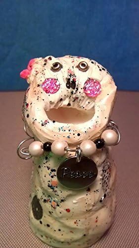 Bruce. Sea Monster Charm. A unique, one of a kind, hand sculptured gift. I have pink cheeks and look like a baby clown. I was found in a circus sitting on the high wire.