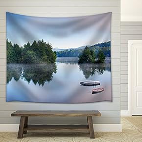 a Lake in The Early Morning with Fog on The Water. a Boat and Dock are in The Foreground. - Fabric Wall Tapestry Home Decor - 51x60 inches