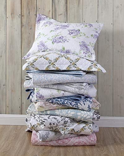 Laura Ashley reversible cotton quilt in ash grey and white, displayed on a mattress.