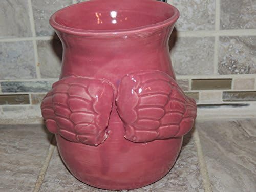 Hand Thrown one of a kind vase. Unique raised Angel Wings, Unique Rose colored glaze. Measures 6 x5.