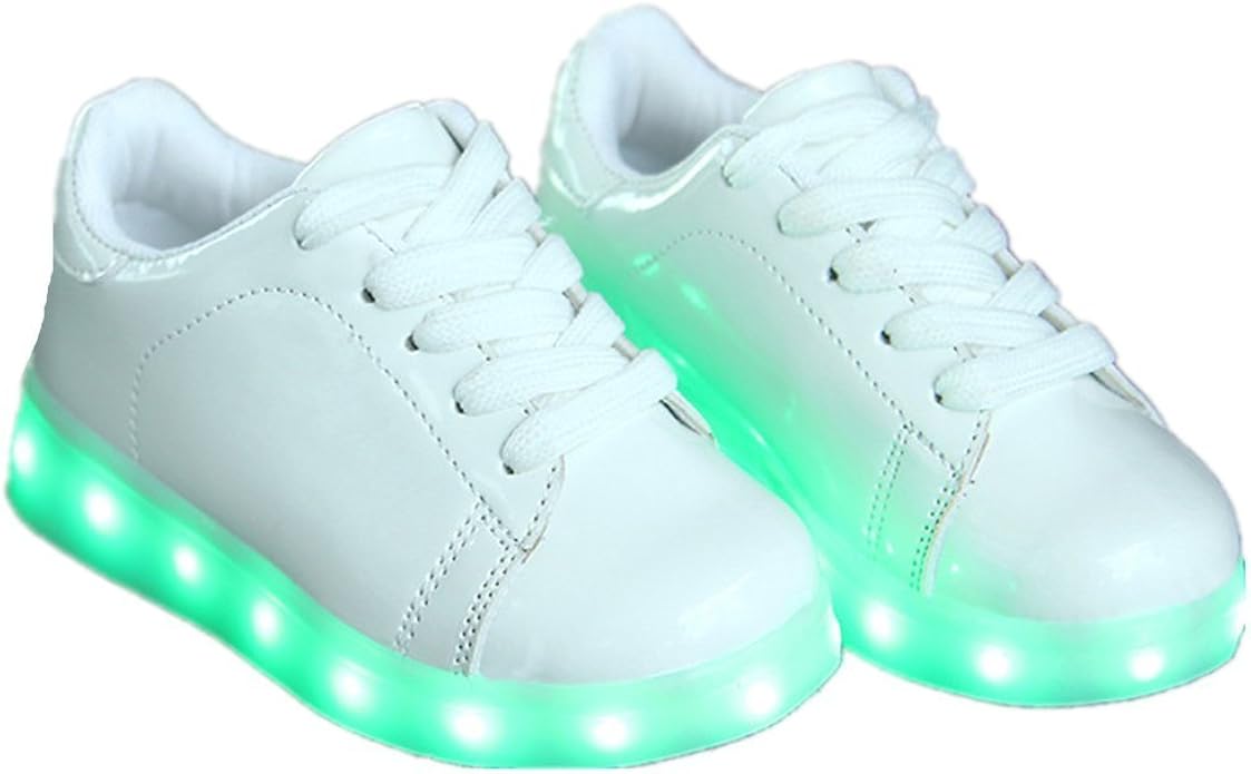 white tennis shoes with green back