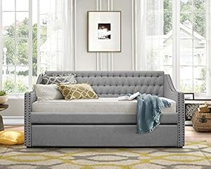 Gray hide-a-bed with trundle open and mattresses in place