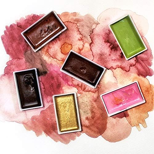 A set of Gansai Tambi watercolor palette pans in various colors.