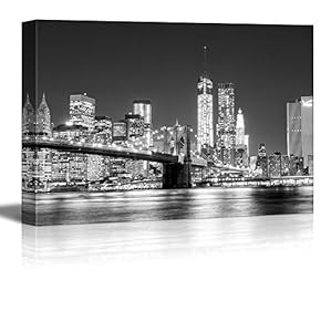 The Manhattan Skyline and Brooklyn Bridge at Night...