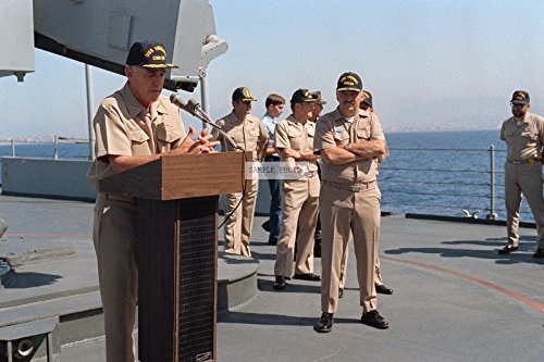 Photo The OLIVER HAZARD PERRY class Guided Missile Frigate USS BOONE (FFG-28) sails past the Statue of Liberty as it makes it's way up the Hudson River to kick off Fleet Week 2002. More than 6,000 Sailors, Marines and Coast Guard personnel aboard 22 ships - including six warships returning from deployment in support of Operation ENDURING FREEDOM, sail into New York City for the 15th Annual Fleet Week 2002, 05/22/2002