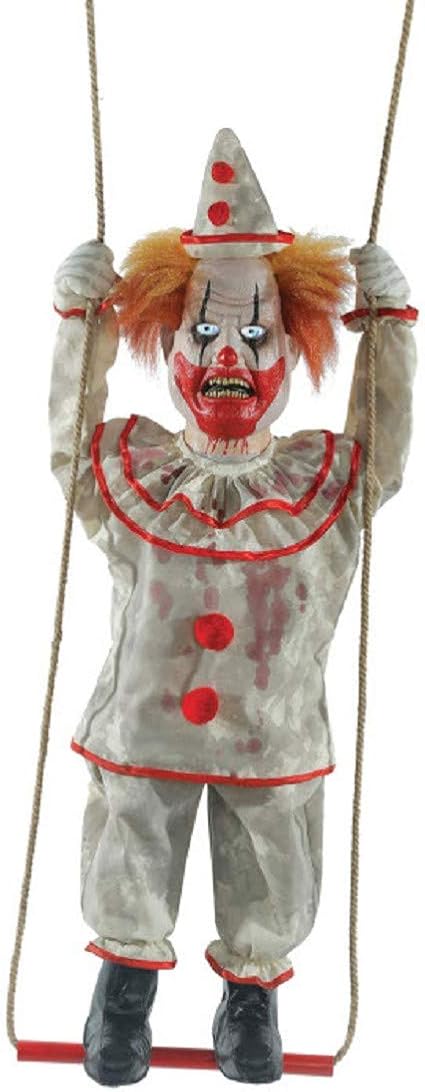 porcelain clown doll on swing