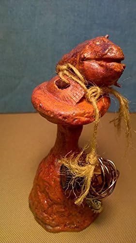 Clyde. Sea Monster Charm. A unique, one of a kind, hand sculptured gift. I'm a fish perched up on a rock. I have a bottle of Tea Tree Oil hanging by my side to give as a gift to my one true love.