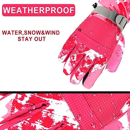 Pair of children's gloves hanging on a door handle