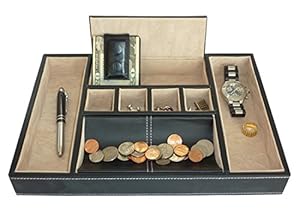 Black valet tray containing coins and a watch