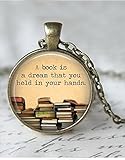 Round 'A book is a dream you can hold in your hands' quote glass dome pendant necklace