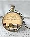 Round 'A book is a dream you can hold in your hands' quote glass dome pendant necklace