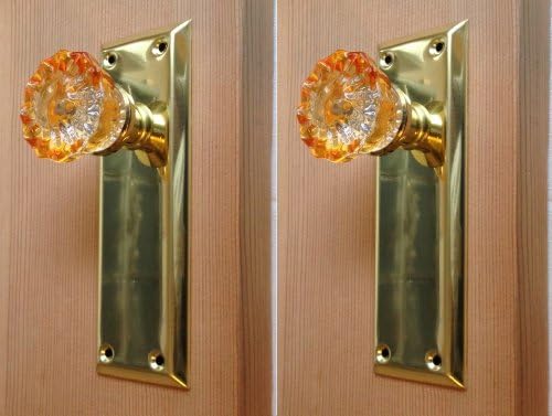 Two Surface Mount Amber Dummy Knobs. Perfect Replica of the 1900‘s Depression Crystal Knob color-coated on the sides and reflects to the center. Includes installation hardware