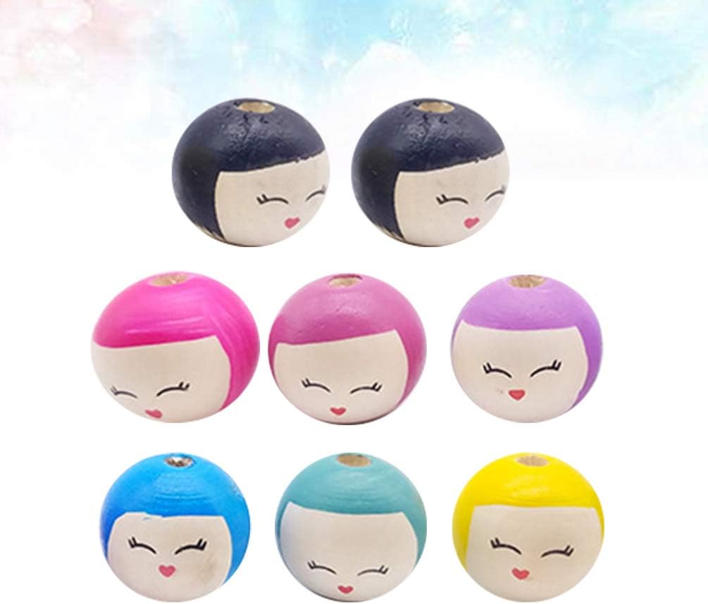 wooden doll heads with faces