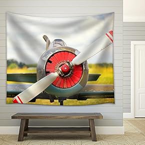 View on Propeller on Old Russian Airplane on Green Grass - Fabric Wall Tapestry Home Decor - 51x60 inches