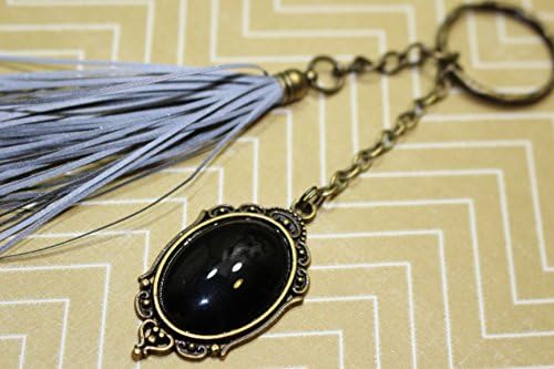 Reflective purse charm with tassel, life saving handmade pendant charm to a purse, coat, backbag, zipper pull.