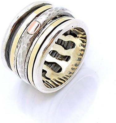 Wide silver spinner ring with hammered lace design rose gold bands