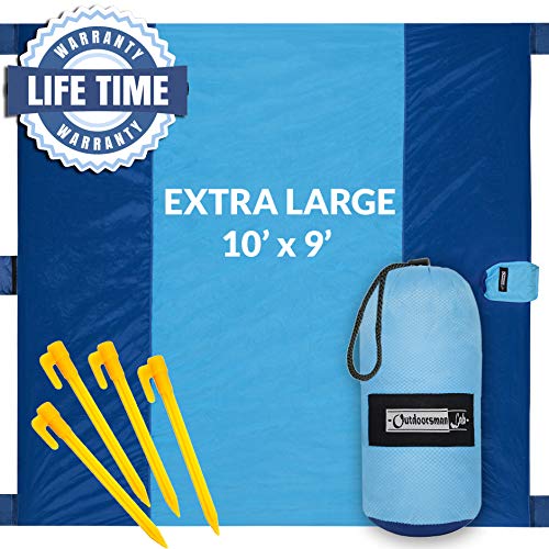 Outdoorsman Lab Sand Free Beach Blanket | Water Repellant Sand Proof Beach Mat | 10’x9′ Parachute Nylon for Picnics, Camping, Concerts | 6 Sand Pockets, 4 Pegs, Carrying Bag & Strap