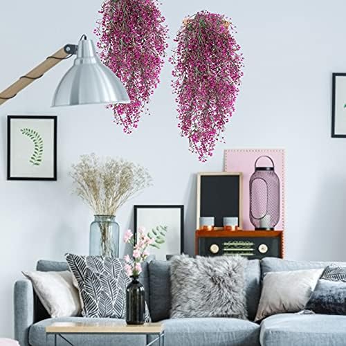 Hanging synthetic vines in plastic containers for decor.