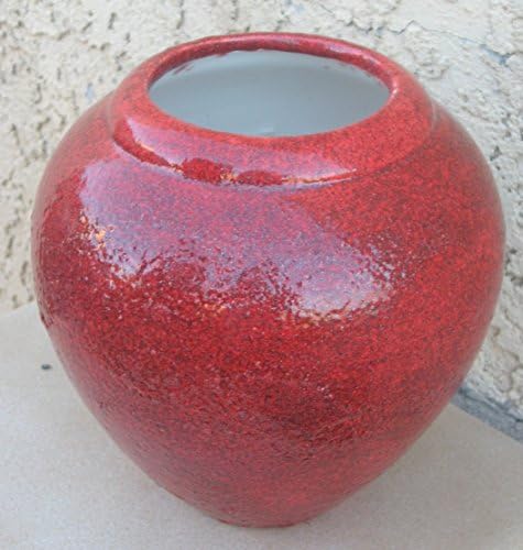 Handmade round burnt orange vase or seed pot. Made by Native artisan