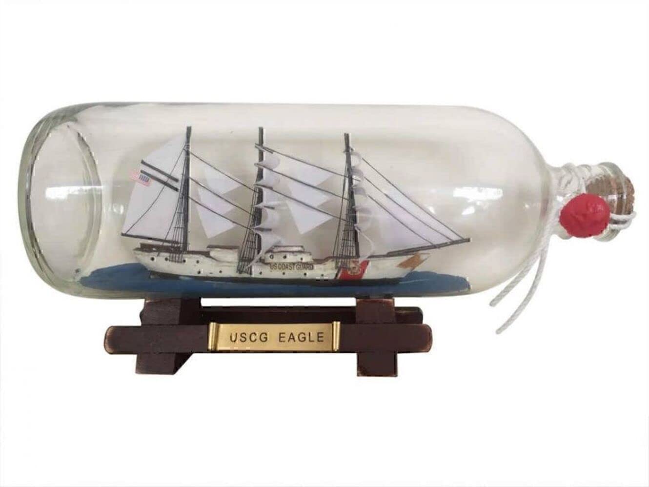 Photo 1 of **SHIP UNGLUED FROM BOTTLE**Hampton Nautical United States Coast Guard USCG Eagle Model Ship in A Glass Bottle, 9" , White,96 months to 600 months