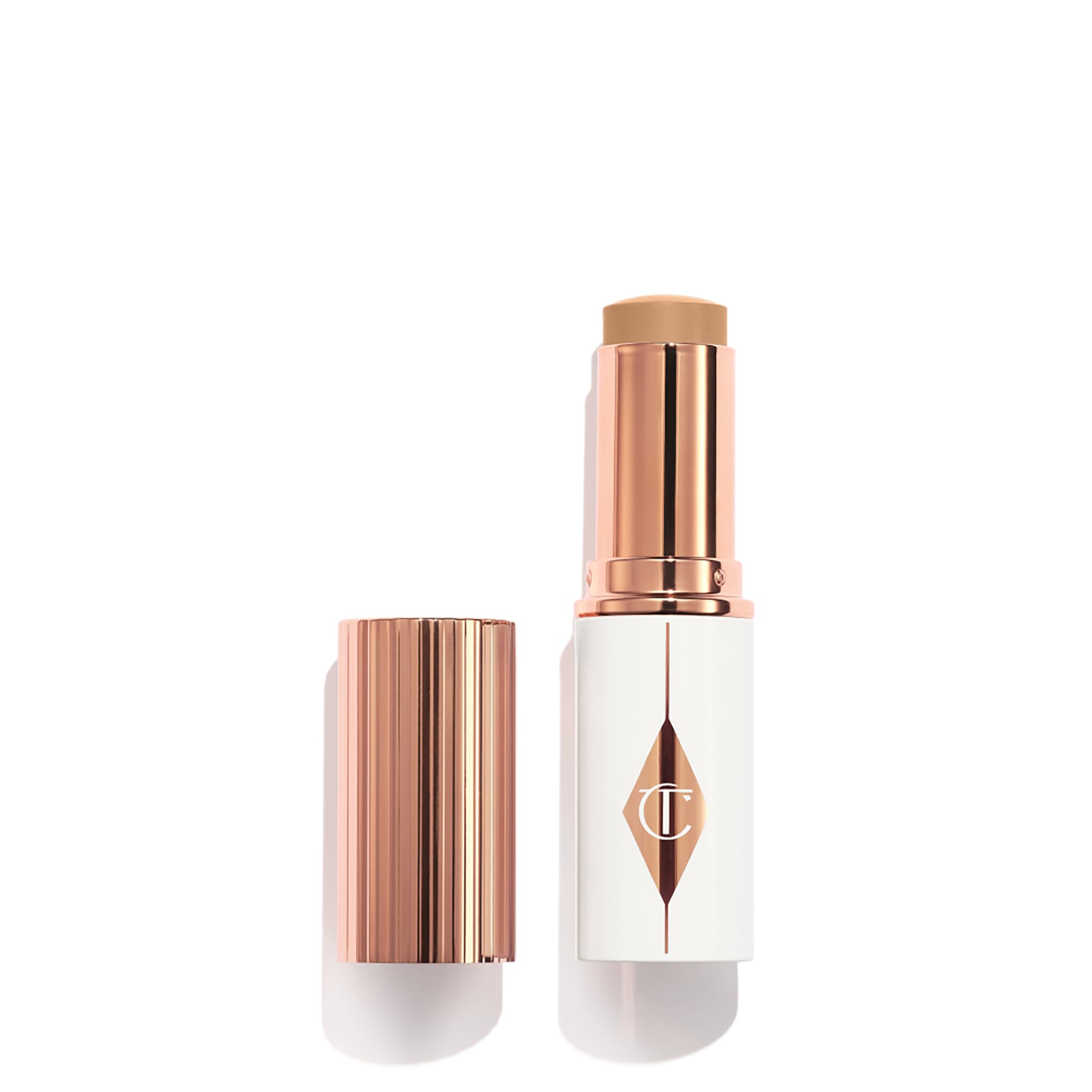 Photo 1 of Charlotte Tilbury Unreal Skin Tint & Sheer Glow Hydrating Foundation Stick - Cream Foundation Makeup with Sheer-to-Light Coverage & a Buildable Formula - Blurring, Smoothing & Nourishing - 7.5 Medium