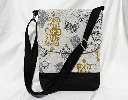 Designer fabric crossbody bag. Adjustable shoulder strap.