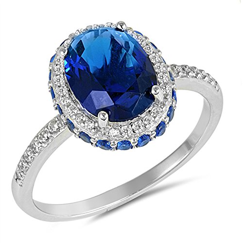 Oval blue simulated sapphire sideways halo ring .925 st…