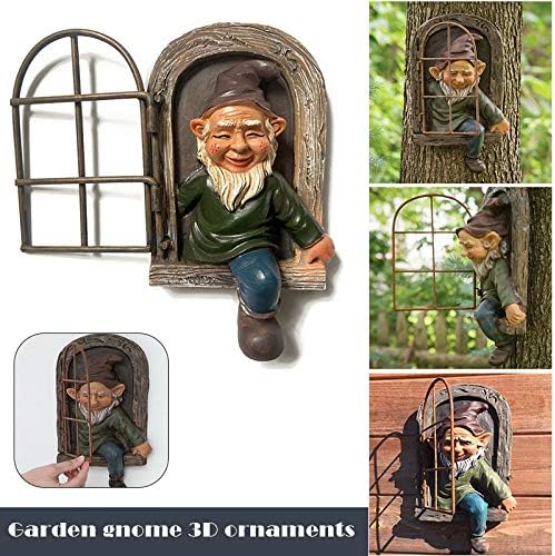 Colorful backyard gnome statue standing next to a tree.