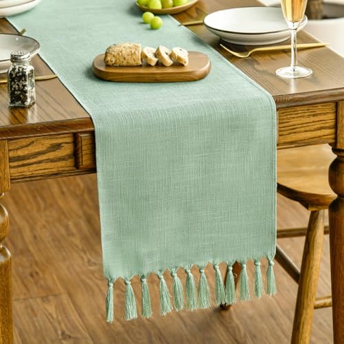 Photo 1 of Artoid Mode Sage Green Tassel Table Runner, Spring Linen Blend Rustic Farmhouse Style Kitchen Table Decoration Holiday Wedding Party Dinning Decor 13x36 Inch