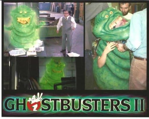 Amazon Com Slimer From Ghostbusters Ii With Rick Moranis And Actor Getting Into Slimer Costume 8 X 10 Photo Entertainment Collectibles