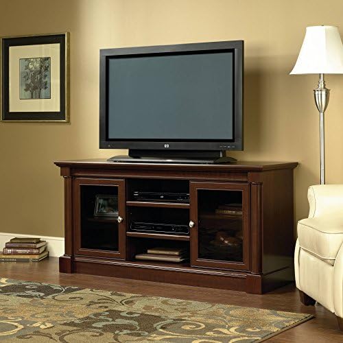 Palladia Entertainment Credenza for TV's up to 60", Cherry Finish 2 open adjustable shelves 1 adjustable shelf behind Antiqued metal pulls Product Dimensions (L x W x H): 18.90 x 59.45 x 28.50 Inches