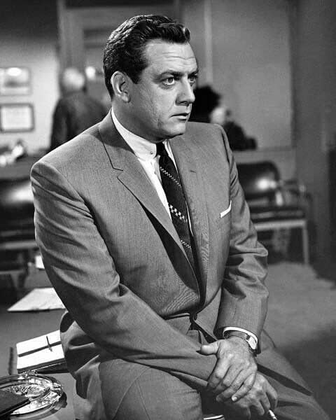 Photographs - Raymond Burr as Perry Mason sitting on his desk smoking cigarette 8x10 photo