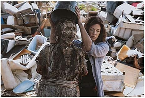 The Walking Dead Polly Mcintosh As Jadis Pulling Bucket Off Head Of Walker 8 X 10 Inch Photo At Amazon S Entertainment Collectibles Store
