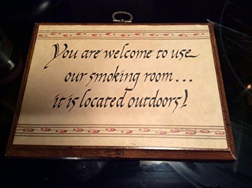 No Smoking Plaque That Reads , " You Are Welcome to Use Our Smoking Room... It Is Located Outdoors !"