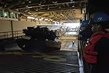Home Comforts A M1A1 Main Battle Tank Drives from a Landing Craft air Cushion (LCAC) Aboard The Multipurpose Amphi