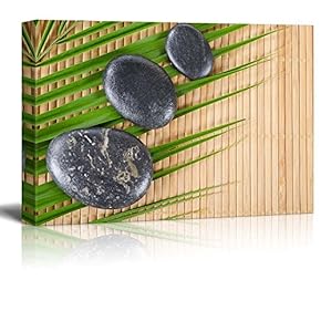 Rocks on a Palm Leaf Over a Bamboo Mat - Canvas Art Home Art - 12x18 inches