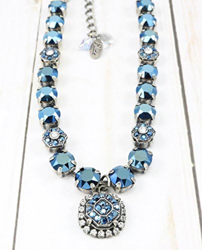 Halo Metallic Necklace is made with Genuine 8mm Swarovski Crystals and embellishments. A statement necklace that is eye catching with out being over the top!