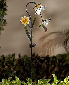Jardín mariposa, colibrí y libélula Solar flor juego por lago ...
