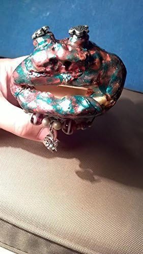 Fred. Sea Monster Charm. A unique, one of a kind, hand sculptured gift. Swirly teal and brown colors and starry eyes! I was found by an old sea captain in the middle of the sea.