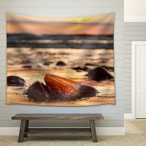 Amber Stone on The Beach at Sunset. Precious Gem, Treasure Concept. Baltic Sea, Poland. - Fabric Wall Tapestry Home Decor - 51x60 inches