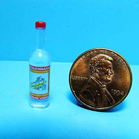 muñecas en botellas de vidrio