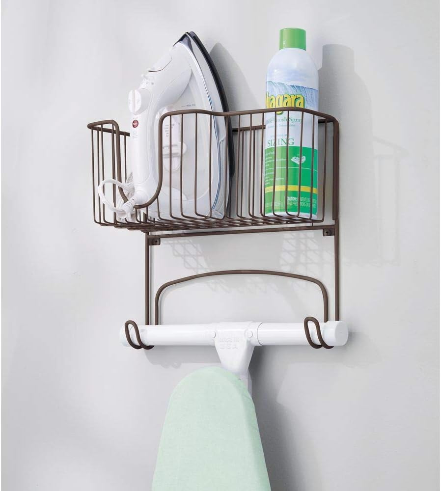 mDesign Metal Wall Mount Ironing Board Holder with Large Storage Basket - Holds Iron, Board, Spray Bottles, Starch, Fabric Refresher for Laundry Rooms - Bronze: Home & Kitchen