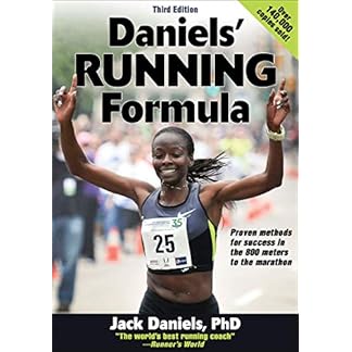 The cover of the third edition of "Daniels' Running Formula" by Jack Daniels, PhD, featuring a triumphant female runner raising her arms in victory, wearing a race bib with the number 25. The vibrant design highlights proven methods for success in races from 800 meters to the marathon, with a yellow banner noting "Over 140,000 copies sold!" and the title prominently displayed.