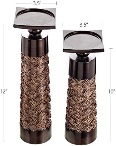 Decorative candle set with holder on a desk.