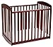 Davinci Alpha Mini Rocking Crib in Rich Cherry, Removable Wheels, Greenguard Gold Certified