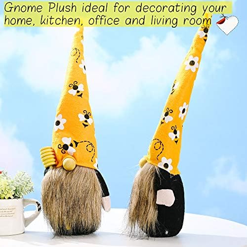 Garden gnome with a bee on its nose, holding a present, on a desk.