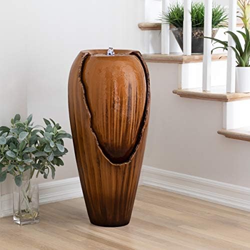 Tiered outdoor water fountain with cascading jars, creating a waterfall effect.